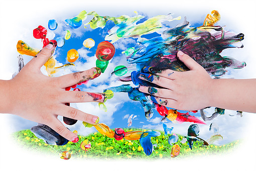 Closeup Of Little Children Hands Doing Finger Painting With Vari